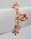 A warm rose goldtone style with colorful rhinestone accented heart-shaped charm on a link chain. Rose goldtone brassGlass stonesLength, about 7½Toggle closureImported 