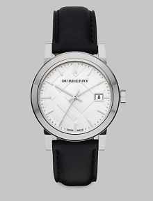 An iconic check stamped dial with a sleek stainless steel case and a supple leather strap. Swiss quartz movementWater resistant to 5 ATMRound stainless steel case, 34mm (1.3)Smooth bezelSilver check stamped dialBar hour markersDate display at 3 o'clockSecond hand Black leather strapMade in Switzerland An iconic check stamped dial with a sleek stainless steel case and a supple leather strap. Swiss quartz movementWater resistant to 5 ATMRound stainless steel case, 34mm (1.3)Smooth bezelSilver check stamped dialBar hour markersDate display at 3 o'clockSecond hand Black leather strapMade in Switzerland