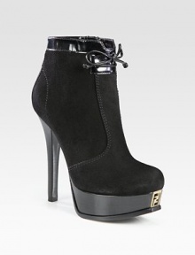 Luxe suede and patent leather design resting on a logoed platform and stacked heel. Stacked heel, 5¼ (130mm)Stacked platform, 1¼ (30mm)Compares to a 4 heel (100mm)Suede and patent leather upperLeather lining and solePadded insoleMade in ItalyOUR FIT MODEL RECOMMENDS ordering one half size up as this style runs small. Luxe suede and patent leather design resting on a logoed platform and stacked heel. Stacked heel, 5¼ (130mm)Stacked platform, 1¼ (30mm)Compares to a 4 heel (100mm)Suede and patent leather upperLeather lining and solePadded insoleMade in ItalyOUR FIT MODEL RECOMMENDS ordering one half size up as this style runs small.