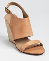 In burnished vachetta leather, these Rebecca Minkoff wedges offer elevated summer style for chic sophisticates.