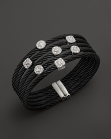 Diamonds set in white gold on a stainless steel and black PVD bangle. By Charriol. Diamonds set in white gold on a stainless steel and black PVD bangle. By Charriol.