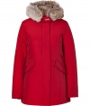 Stylish and sporty red down coat in a washable cotton blend from the American heritage label Woolrich - Tapers slightly at waist, hits at mid-thigh - Rabbit fur collar lends this coat a veritable feeling of warmth and luxe - Water and snow resistant, with multiple pockets and hood - Exceptionally warm, can be worn in temperatures as low as -30 F - A versatile, classically elegant coat that can be worn for life - Perfect for both city streets and country slopes