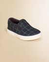 An adorable slip-on sneaker is rendered in durable preppy plaid canvas.Slip-on with elastic goreCanvas upperCotton canvas liningRubber solePadded insoleImported