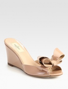 A comfortable wedge lifts this bow-trimmed silhouette, expertly crafted in Italy of luxurious patent leather. Self-covered heel, 3 (75mm)Patent leather upperLeather lining and solePadded insoleMade in Italy A comfortable wedge lifts this bow-trimmed silhouette, expertly crafted in Italy of luxurious patent leather. Self-covered heel, 3 (75mm)Patent leather upperLeather lining and solePadded insoleMade in Italy