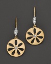 Diamonds sparkle from flower-inspired drop earrings.