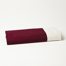A luxurious jacquard flat sheet with a contrasting solid border from Edmond Frette. A luxurious jacquard flat sheet with a contrasting solid border from Edmond Frette.