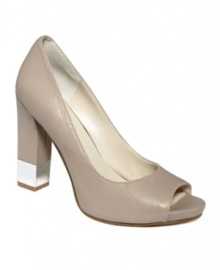 On the go and looking sharp. The Moveit pumps by Nine West kick it up a notch with a mirrored accent on the chunky heel of this peep-toe silhouette. On the go and looking sharp. The Moveit pumps by Nine West kick it up a notch with a mirrored accent on the chunky heel of this peep-toe silhouette.