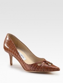 Classic point toe pump in rich crocodile-embossed leather with logo-detail metal ties. Self-covered heel, 2½ (65mm)Crocodile-print leather upperPoint toeLeather lining and solePadded insoleMade in Italy Classic point toe pump in rich crocodile-embossed leather with logo-detail metal ties. Self-covered heel, 2½ (65mm)Crocodile-print leather upperPoint toeLeather lining and solePadded insoleMade in Italy