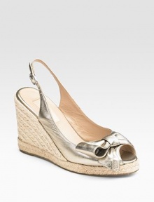 Shimmery metallic leather wraps into a lovely bow at the peep toe.Roped wedge, 4 (100mm) Roped platform, ¾ (20mm) Compares to a 3¼ heel, (80mm) Adjustable ankle strap Leather lining Padded insole Rubber sole Made in ItalyOUR FIT MODEL RECOMMENDS ordering true whole size; ½ sizes should order the next whole size up. Shimmery metallic leather wraps into a lovely bow at the peep toe.Roped wedge, 4 (100mm) Roped platform, ¾ (20mm) Compares to a 3¼ heel, (80mm) Adjustable ankle strap Leather lining Padded insole Rubber sole Made in ItalyOUR FIT MODEL RECOMMENDS ordering true whole size; ½ sizes should order the next whole size up.