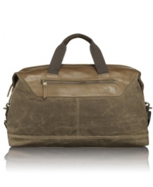 Distressed leather trim, wax-coated canvas, contrast stitching accents and antiqued brass hardware make this simple and roomy satchel ideal for your overnight or weekend getaways. Distressed leather trim, wax-coated canvas, contrast stitching accents and antiqued brass hardware make this simple and roomy satchel ideal for your overnight or weekend getaways.
