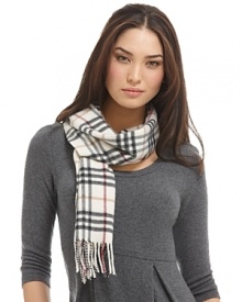 Luxuriously soft cashmere scarf in an all over check pattern is finished with fringe trim. Luxuriously soft cashmere scarf in an all over check pattern is finished with fringe trim.
