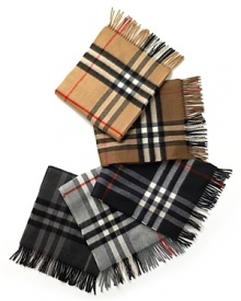 Soft, woven cashmere muffler with fringe in iconic check pattern.