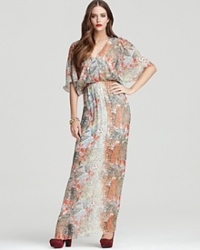 A lush watercolor print and billowy blouson bodice give this 1970s-inspired Alice + Olivia maxi dress boho-luxe appeal. Pair with rich jewel-tone platforms and a gold-tone bracelet for the ultimate rich hippie look. A lush watercolor print and billowy blouson bodice give this 1970s-inspired Alice + Olivia maxi dress boho-luxe appeal. Pair with rich jewel-tone platforms and a gold-tone bracelet for the ultimate rich hippie look.