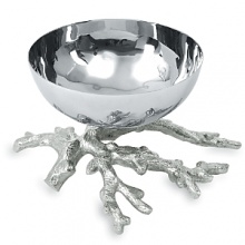 A lively cluster of coral supports the mirrored bowl of this elegant nut dish, evoking the interwoven web of ocean life. A lively cluster of coral supports the mirrored bowl of this elegant nut dish, evoking the interwoven web of ocean life.