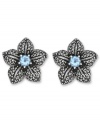 Springtime sparkle. Genevieve & Grace's delicate flower stud earrings feature a round-cut blue topaz center (1 ct. t.w.) with glittering marcasite petals. Crafted in sterling silver. Earrings feature an omega clip-on backing for non-pierced ears. Approximate diameter: 7/8 inch.