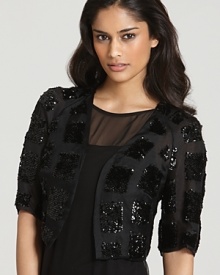 This versatile Carmen Marc Valvo metallic Jacket is just as chic paired with jeans as it is layered over a fancy frock. This versatile Carmen Marc Valvo metallic Jacket is just as chic paired with jeans as it is layered over a fancy frock.