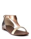 In gilded metallic hues, these gleaming flat sandals from Boutique 9 add shimmering shine and every day glamour.