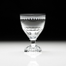 The original Flavia was made in England in about 1790 and has what is called a lemon squeezer foot. These were not made after about 1850 and this shape is much sought after by collectors. The intricate design around the rim is completely hand engraved, wtih each cut individually applied with an engraving wheel. It takes many hours of highly skilled work to complete one glass. The original Flavia was made in England in about 1790 and has what is called a lemon squeezer foot. These were not made after about 1850 and this shape is much sought after by collectors. The intricate design around the rim is completely hand engraved, wtih each cut individually applied with an engraving wheel. It takes many hours of highly skilled work to complete one glass.