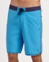 A modern, knee-length swim favorite in quick-dry nylon with tonal trim and ventilating grommets. Drawstring waist Side slash, back patch pockets Mesh lining Inseam, about 9½ Polyester Machine wash Imported 