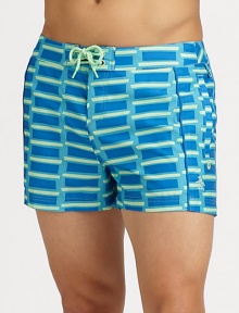 A sleek, form-fitting look with pieced construction and brilliant color that revives a classic beach style. Drawstring waistSide, back pocketsMesh liningInseam, about 3PolyesterMachine washImported A sleek, form-fitting look with pieced construction and brilliant color that revives a classic beach style. Drawstring waistSide, back pocketsMesh liningInseam, about 3PolyesterMachine washImported