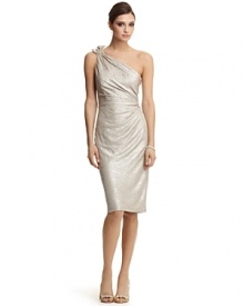 This one-shoulder number from David Meister is a gleaming metallic statement of style. Jeweled floral embellishment on straps. Neutral heels provide a perfect balance.