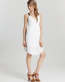 A breezy white Volcom dress gets a dose of attitude from black straps and an exposed back zipper, taking this beachy look into after hours when the bonfire lights up. A breezy white Volcom dress gets a dose of attitude from black straps and an exposed back zipper, taking this beachy look into after hours when the bonfire lights up.