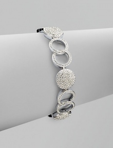 A gorgeous piece featuring circles and links accented with brilliant pavé crystals. CrystalsRhodium-plated brassLength, about 7¼ Tongue-and-box closureImported A gorgeous piece featuring circles and links accented with brilliant pavé crystals. CrystalsRhodium-plated brassLength, about 7¼ Tongue-and-box closureImported