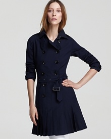 The classic Burberry Brit trench coat gets a cool new attitude with a skirted hemline. Offset the striking silhouette with white denim for modern femininity. The classic Burberry Brit trench coat gets a cool new attitude with a skirted hemline. Offset the striking silhouette with white denim for modern femininity.