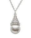 Let seaside style wash over your neckline. This summery-fresh pendant by Swarovski highlights a white crystal pearl drop accented by clear crystal pavé. Set in silver tone mixed metal. Approximate length: 15 inches. Approximate drop: 3/4 inch.