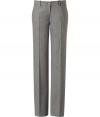 Stylish flannel pants in a fine pure wool-spandex blend - Light grey in a heathered look - Exclusive, ultra high quality from American designer Michael Kors - Feminine, ladylike style that looks grown up, smart, dressy - The pants are straight with a wide leg cut - With visible creases and a classic waistband with belt loops and button close - Typical classic office pants you can wear with slim tops (blouse, top, blazer) - After work, style with a glam top