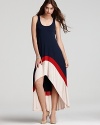 Bold color blocking and a dramatic high/low hem take this Akiko maxi dress to the next level of chic.