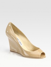 Elegant patent leather wedge transitions smoothly from office hours through after hours. Self-covered wedge, 3½ (90mm)Patent leather upperLeather liningBuffed leather solePadded insoleMade in ItalyOUR FIT MODEL RECOMMENDS ordering one half size up as this style runs small. 