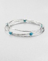 From the Rock Candy® Collection. A trio of hammered, sterling silver bangles accented with colorful, faceted turquoise. Sterling silverTurquoiseDiameter, about 2.5Slip-on styleImported 