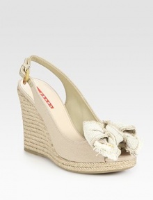 Canvas and espadrille wedge design with bow detail and an adjustable slingback. Espadrille wedge, 4 (100mm)Espadrille platform, ½ (15mm)Compares to a 3½ heel (90mm)Canvas upperLeather liningRubber solePadded insoleImportedOUR FIT MODEL RECOMMENDS ordering true size. Canvas and espadrille wedge design with bow detail and an adjustable slingback. Espadrille wedge, 4 (100mm)Espadrille platform, ½ (15mm)Compares to a 3½ heel (90mm)Canvas upperLeather liningRubber solePadded insoleImportedOUR FIT MODEL RECOMMENDS ordering true size.