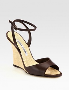 Sleek leather with a sculpted, woven raffia wedge and skinny, wrap-around ankle strap. Raffia wedge, 4 (100mm)Leather upperRaffia liningBuffed leather soleMade in ItalyOUR FIT MODEL RECOMMENDS ordering one half size up as this style runs small. Sleek leather with a sculpted, woven raffia wedge and skinny, wrap-around ankle strap. Raffia wedge, 4 (100mm)Leather upperRaffia liningBuffed leather soleMade in ItalyOUR FIT MODEL RECOMMENDS ordering one half size up as this style runs small.