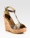 A natural cork wedge and platform is the foundation of this snake-embossed leather silhouette, topped with metallic leather accents. Cork wedge, 4¾ (120mm)Cork platform, 1¼ (30mm)Compares to a 3½ heel (90mm)Snake-embossed leather upper with metallic leather trimAdjustable ankle strapLeather liningRubber solePadded insoleMade in SpainOUR FIT MODEL RECOMMENDS ordering true size. 