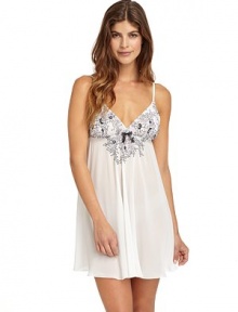 THE LOOKAdjustable twin shoulder strapsEmbroidered floral lace cups and Empire waistElastic Empire waist with center bowV-backTHE FITAbout 31 from shoulder to hemTHE MATERIALPolyesterCARE & ORIGINMachine washImported THE LOOKAdjustable twin shoulder strapsEmbroidered floral lace cups and Empire waistElastic Empire waist with center bowV-backTHE FITAbout 31 from shoulder to hemTHE MATERIALPolyesterCARE & ORIGINMachine washImported