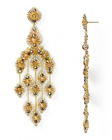 An ornate cascade formed from beautiful 14-karat gold, Swarovski crystals, and topaz accents, Miguel Ases' gleaming chandelier earrings are a captivating jewelry choice. An ornate cascade formed from beautiful 14-karat gold, Swarovski crystals, and topaz accents, Miguel Ases' gleaming chandelier earrings are a captivating jewelry choice.