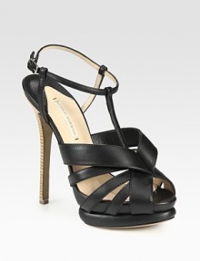 Supple leather t-strap design with an adjustable ankle strap and a unique island platform. Stacked heel, 5 (125mm)Island platform, 1½ (40mm)Compares to a 3½ heel (90mm)Leather upperLeather lining and solePadded insoleMade in ItalyOUR FIT MODEL RECOMMENDS ordering one size up as this style runs small. Supple leather t-strap design with an adjustable ankle strap and a unique island platform. Stacked heel, 5 (125mm)Island platform, 1½ (40mm)Compares to a 3½ heel (90mm)Leather upperLeather lining and solePadded insoleMade in ItalyOUR FIT MODEL RECOMMENDS ordering one size up as this style runs small.