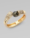 A striking black baroque-shaped shell pearl dramatically caps one end of a Swarovski crystal-laden bangle with a gleaming golden finish.CrystalShell pearl18k goldplatedDiameter, about 2¼Width, about ½Hinged with magnetic claspMade in USA