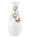 Crafted of elegant white porcelain, this Lenox bud vase combines the beloved Butterfly Meadow motif with a scalloped edge and textured accents for a look of country charm. Qualifies for Rebate