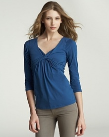 An elegantly twisted neckline elevates this Velvet by Graham & Spencer top. An elegantly twisted neckline elevates this Velvet by Graham & Spencer top.