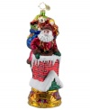 Down through the chimney goes St. Nick! Christopher Radko catches and captures him in the act, recreating the scene in mouth-blown, hand-painted glass. Brilliant color and detail in his face, bag of gifts and in the chimney itself make the ornament a favorite.