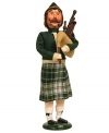 Piping and singing along with his fellow carolers, the Eleven Pipers Piping figurine is an essential companion to the Twelve Days of Christmas collection by Byers' Choice. Handcrafted with a jolly expression, Christmas-plaid kilt and crisp white knee socks.