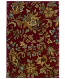 An assemblage of swirling blossoms against a rich sangria-red ground assures a captivating visual addition to your floor. Pairing a hard-twist nylon construction with a special dyeing technique, this transitional piece is designed to recreate the look and feel of the finest antique rugs.