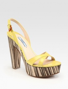 Patent leather design with an adjustable slingback and wood platform and heel. Wooden heel, 5 (125mm)Wooden platform, 1 (25mm)Compares to a 4 heel (100mm)Patent leather upperLeather lining and solePadded insoleMade in Italy Patent leather design with an adjustable slingback and wood platform and heel. Wooden heel, 5 (125mm)Wooden platform, 1 (25mm)Compares to a 4 heel (100mm)Patent leather upperLeather lining and solePadded insoleMade in Italy