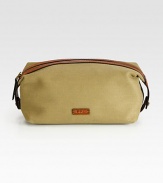 An impeccably stylish carrying case for the modern gentleman, this lightweight pouch in a leather-trimmed canvas construction provides sharp transport for essential toiletries.Zip closureInterior zip pocketAntiqued brass hardwareEmbossed leather logo accents the exteriorCanvas9W x 5HImported