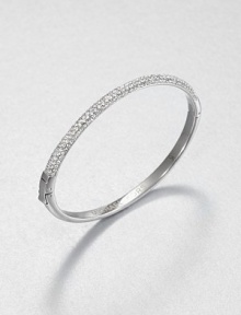 From the Brilliance Collection. Half of this graceful bangle is paved with sparkling rhinestones, the other half has a smooth, polished finish, with a handy hinge in between.GlassSilvertoneDiameter, about 2.5Hinged with push-lock claspImported From the Brilliance Collection. Half of this graceful bangle is paved with sparkling rhinestones, the other half has a smooth, polished finish, with a handy hinge in between.GlassSilvertoneDiameter, about 2.5Hinged with push-lock claspImported