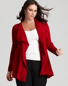 Rendered in vivid merino wool, this Eileen Fisher open cardigan drapes effortlessly over pants and skirts alike, lending itself to both casual and professional looks.