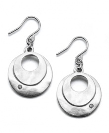 Two silvertone disks glimmer like the moon on these modern Kenneth Cole New York earrings. Crafted in silvertone mixed metal and crystal accents. Approximate drop: 1 inch. Two silvertone disks glimmer like the moon on these modern Kenneth Cole New York earrings. Crafted in silvertone mixed metal and crystal accents. Approximate drop: 1 inch.